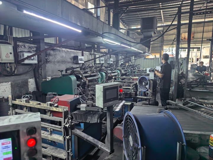 Decoiler feeding steel strip into a press line