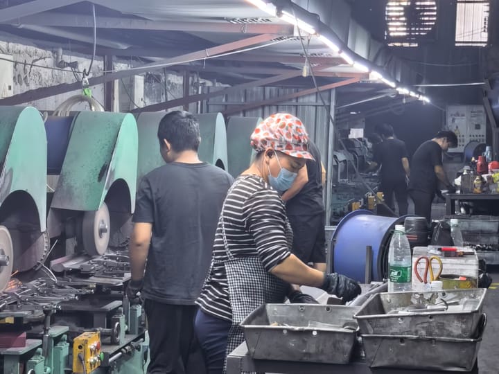 Operator setting up a stamping press