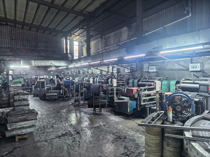 Rows of stamping presses on the workshop floor