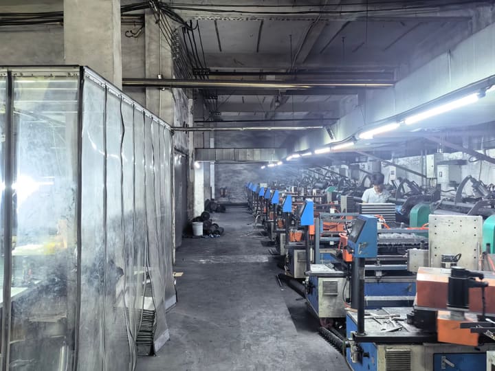 Aisle between rows of machines on the shop floor
