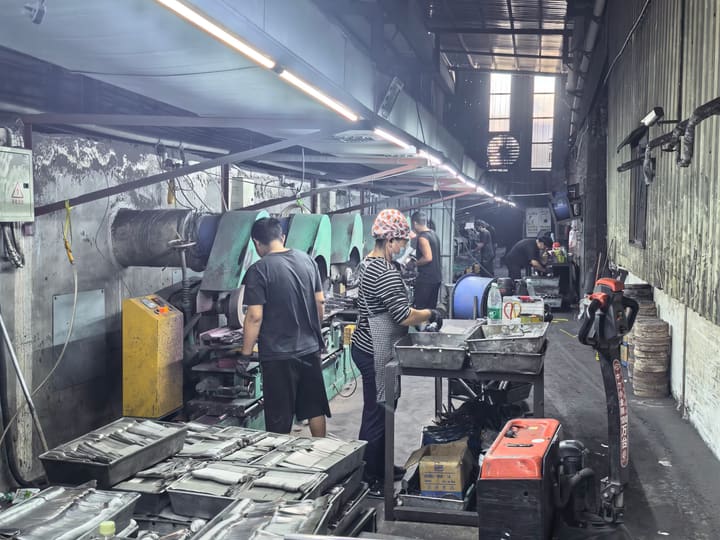 Operator loading parts at a press