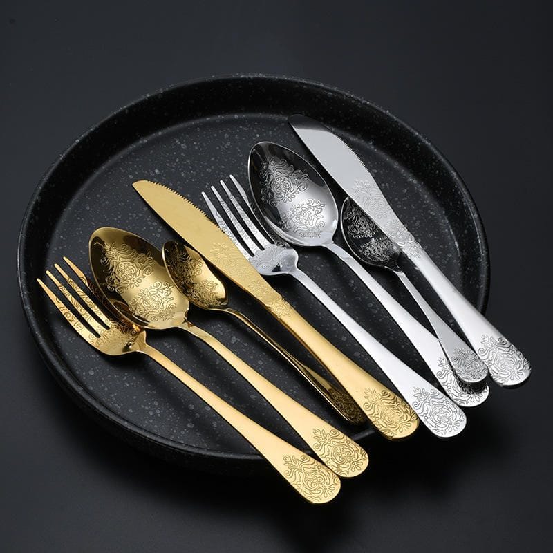 Gold and silver double flower flatware in one 4-piece setting