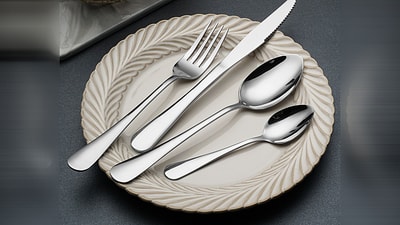 Mirror-polished stainless steel flatware set with fork, knife and spoons