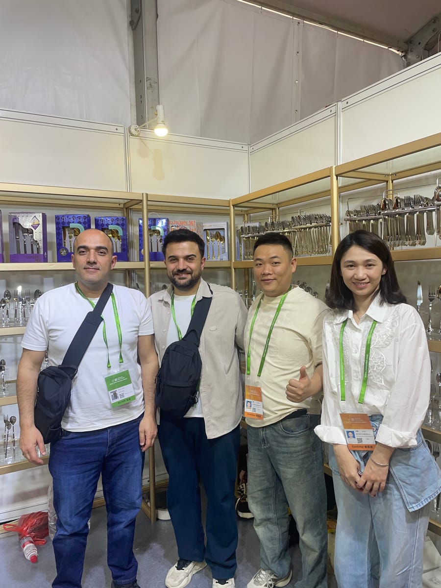 Team with international clients at cutlery exhibition