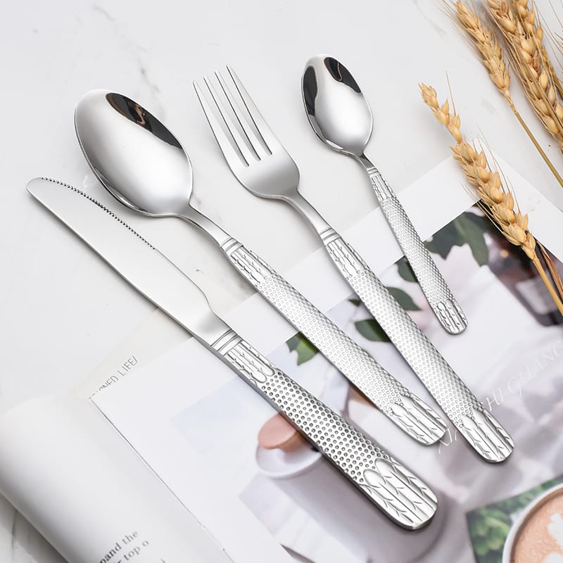 Wheat ear pattern flatware set on marble table, mirror finish